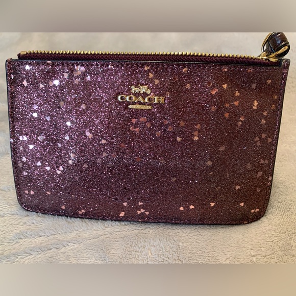 Coach Handbags - Coach Raspberry Glitter Wristlet Used